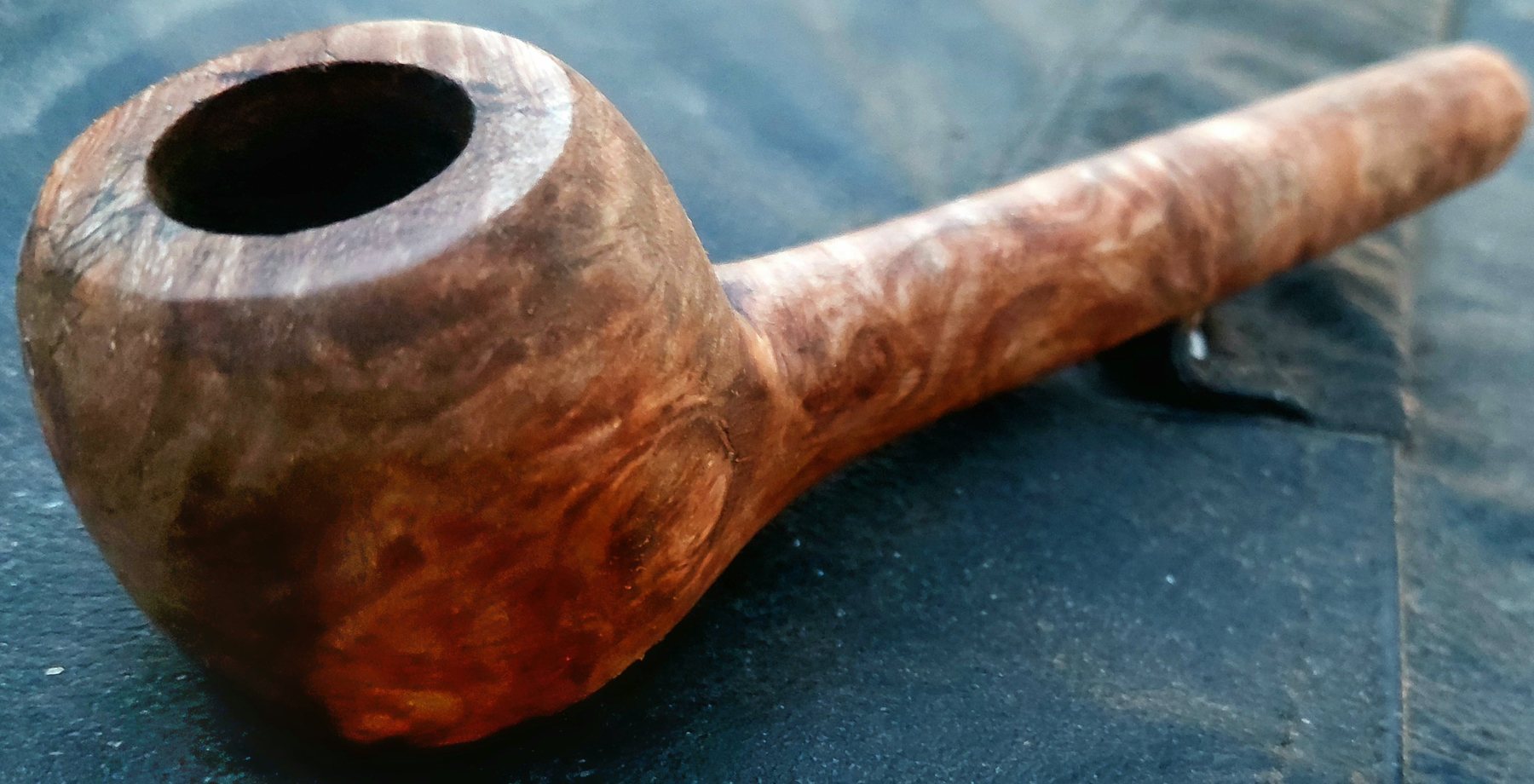 Handmade burl pipe with a straight stem